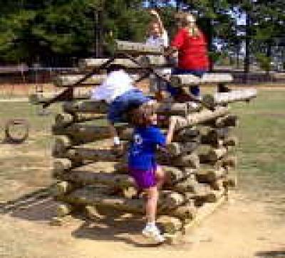 Kids Play On Log Cabin