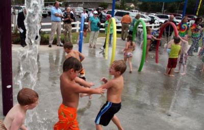 Kids Playing In Celebration Park's Splash Pad